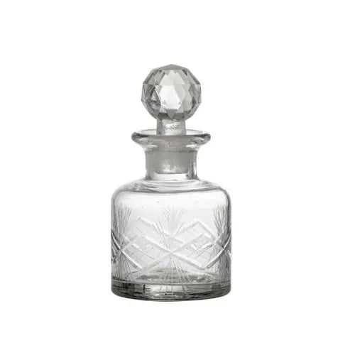Bouteille en verre avec une fermeture capuchonnée en effet cristal