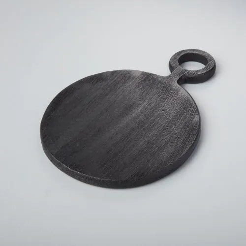 grande planche ronde noire sur fond gris