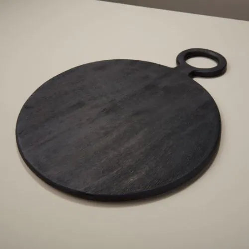 grande planche à découper ronde noire en bois de manguier